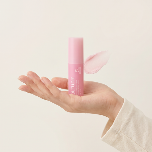 The balm held in an open palm to show its size